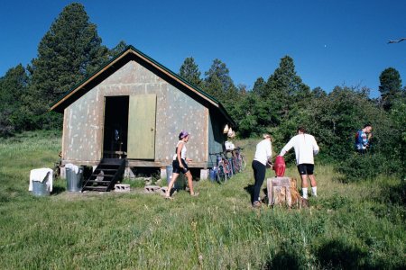 The final hut, La Sal, in a meadow under a blue sky.